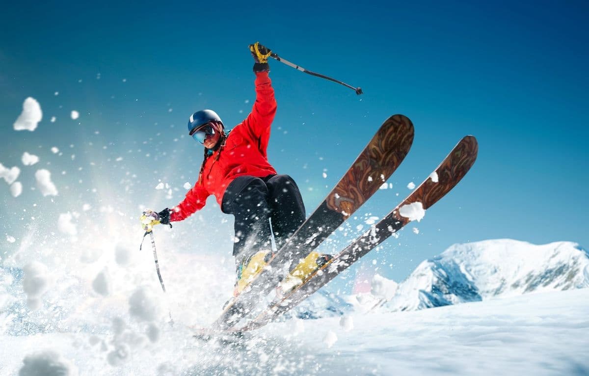 Skier jumping through fresh snow at Vrådal Panorama